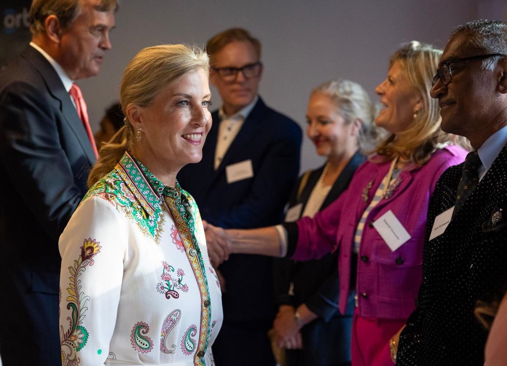 The Duchess of Edinburgh wearing floral shirt dress while talking to guests