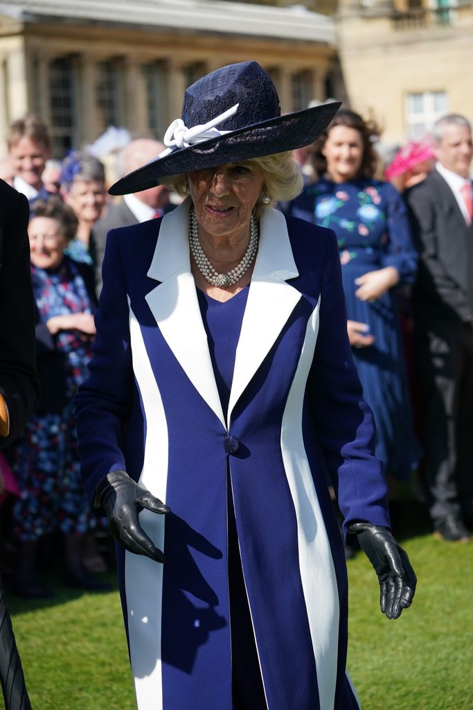 Camilla looked stunning in navy and white