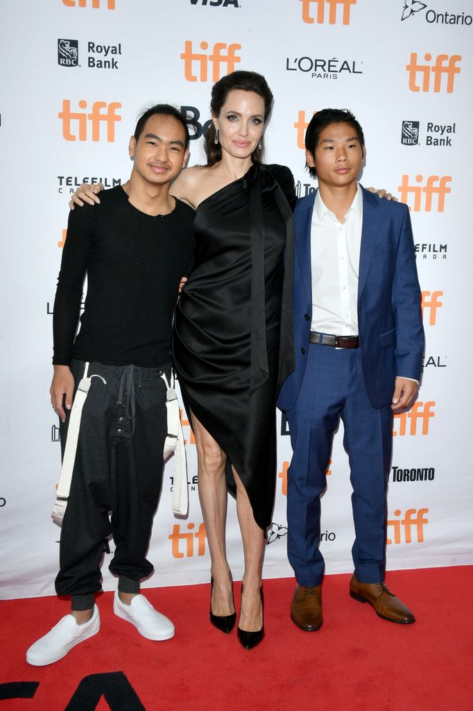 Maddox Jolie-Pitt, Angelina Jolie and Pax Jolie-Pitt attend the "First They Killed My Father" premiere