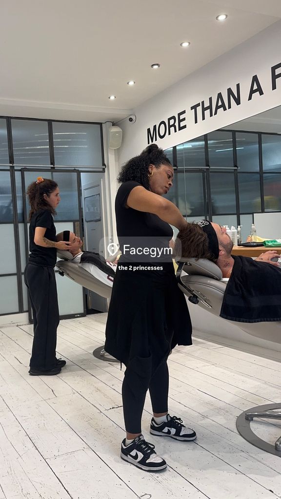 A photo of two men getting a face treatment 