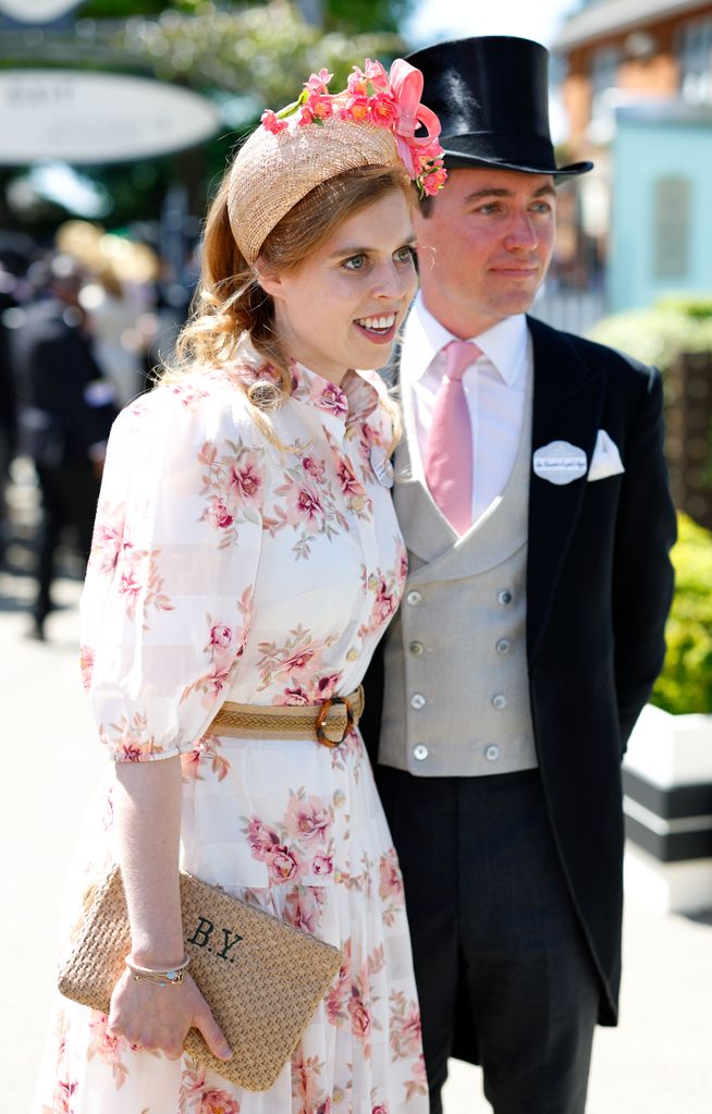 Princess Beatrice wearing a floral headband and dress with husband