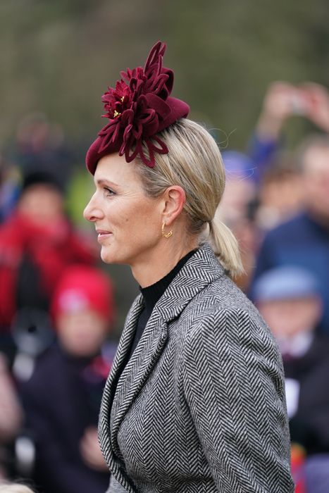zara tindall in a burgundy hat on christmas day 2022