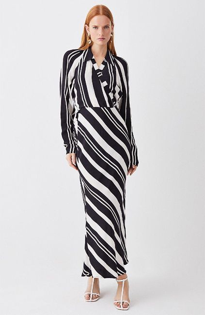 model wearing black and white striped midi dress 