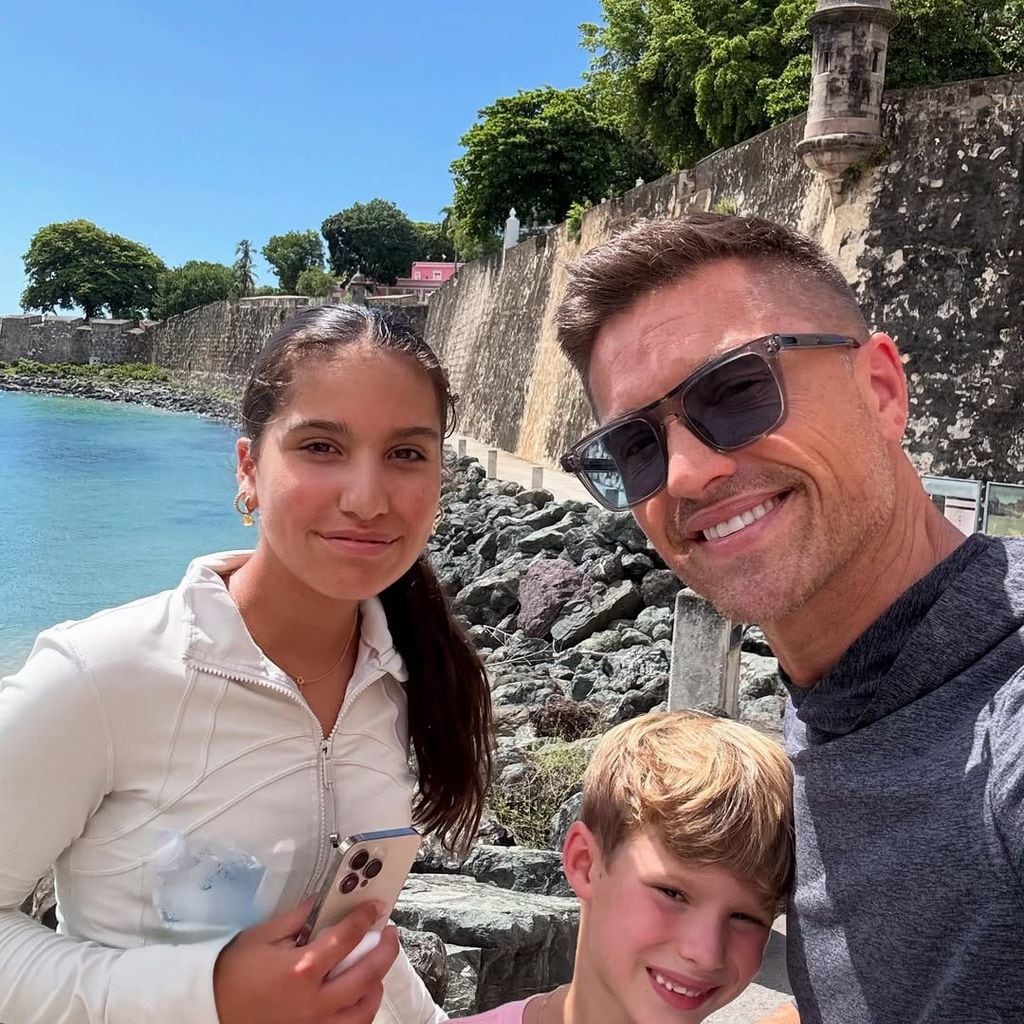 Eric and kids posing waterside selfie