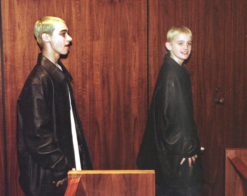 Eminem's half brother Nate, left, and his cousin Joshua Schmitt exit a Macomb County courtroom following Eminem's (Marshall Mathers) sentencing on concealed weapons charges April 10, 2001 in Michigan. Mathers was given two years probation.