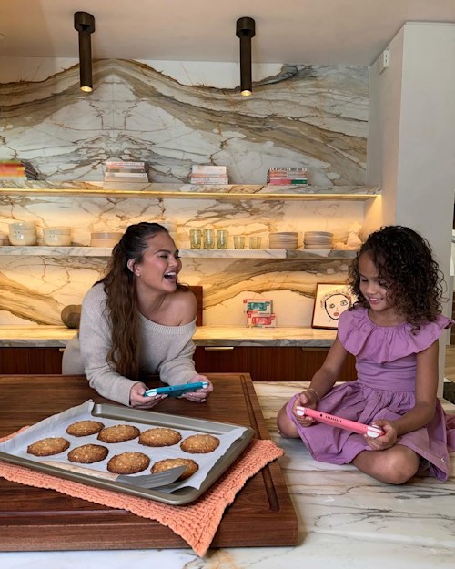 Chrissy in her kitchen with her daughter Luna
