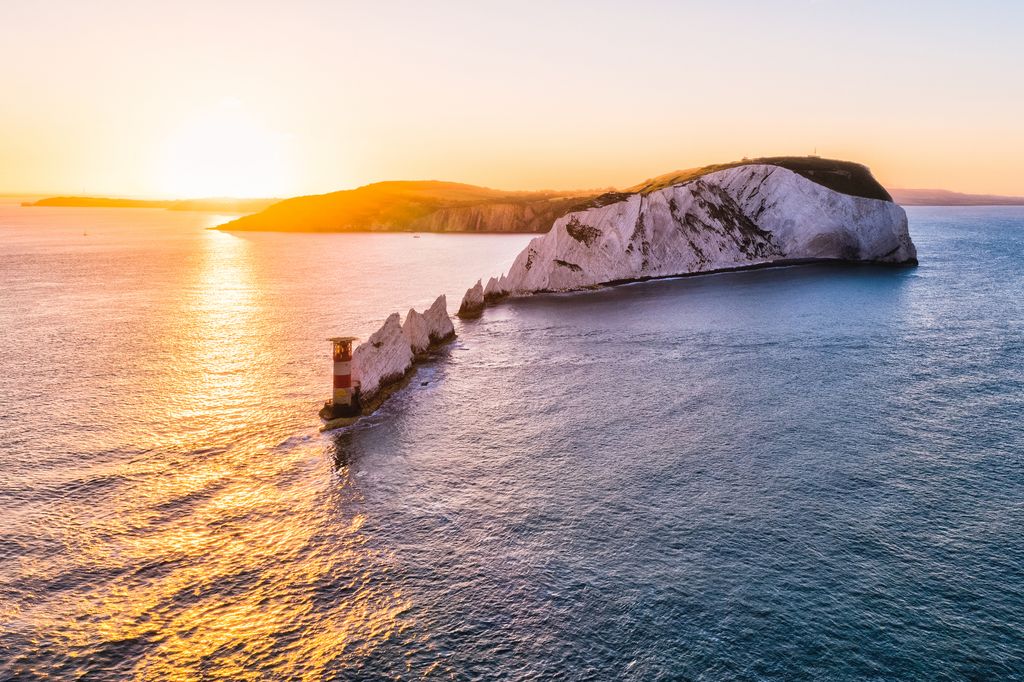 An aerial sunrise view of The Needles Lighthouse, Isle of Wight  