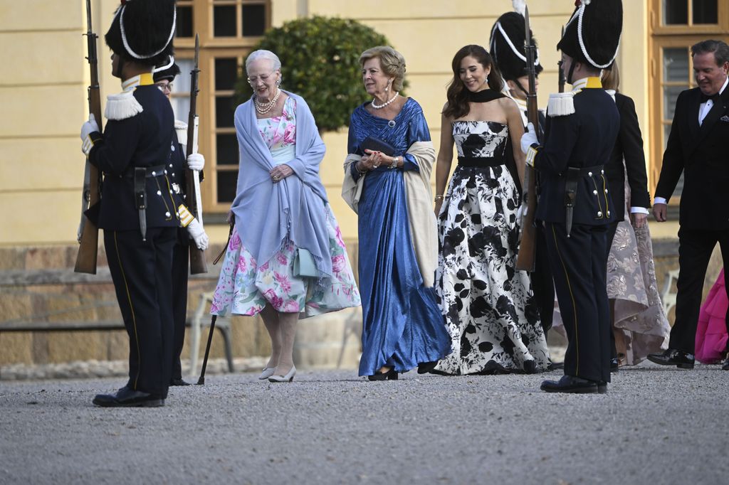Margrethe, who is the King's cousin, wore a floral gown alongside family members