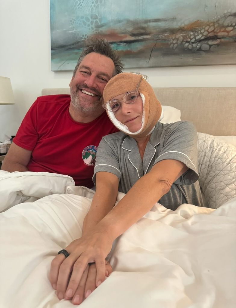 ricki lake with bandages on her head in bed with husband