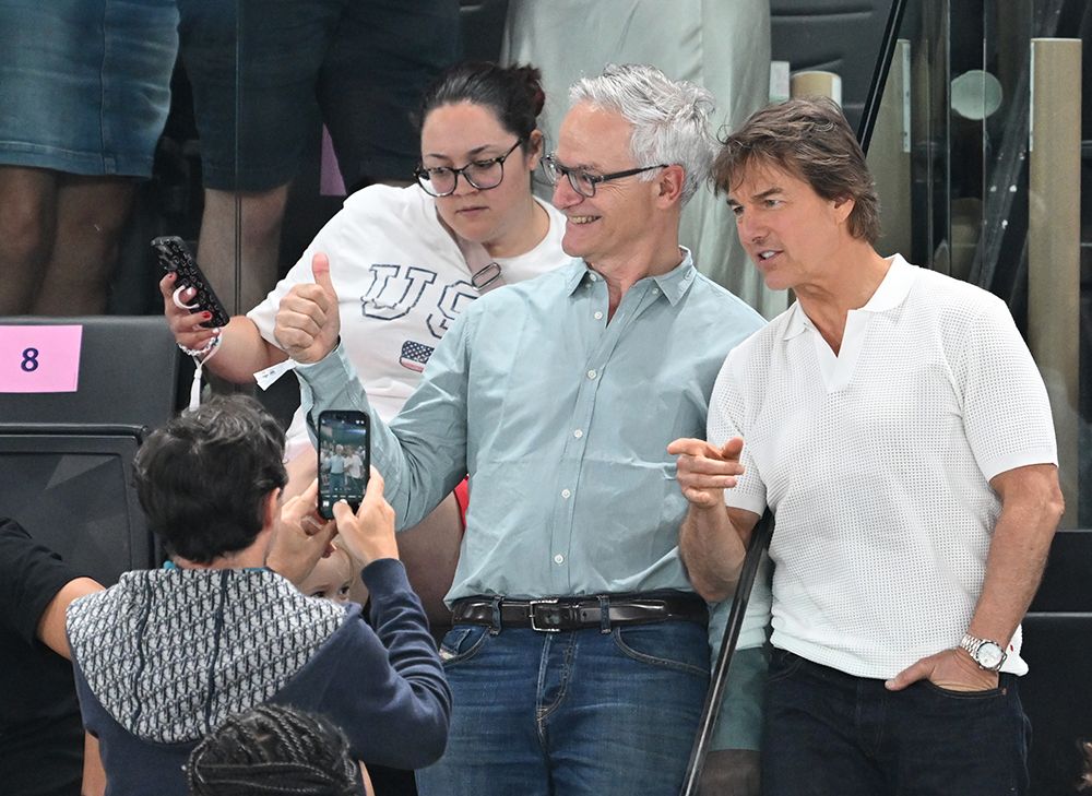 Tom Cruise taking photos with fans at the Paris Olympics