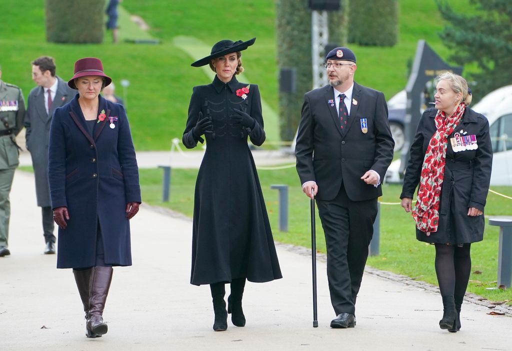 Catherine, Princess of Wales in black walking in line of people