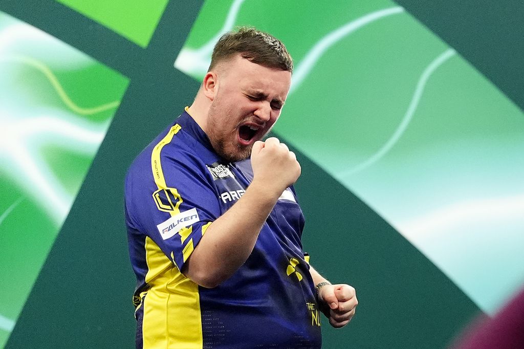 Luke Littler celebrates winning their semi-final match against Stephen Bunting in the Paddy Power World Darts Championship at Alexandra Palace