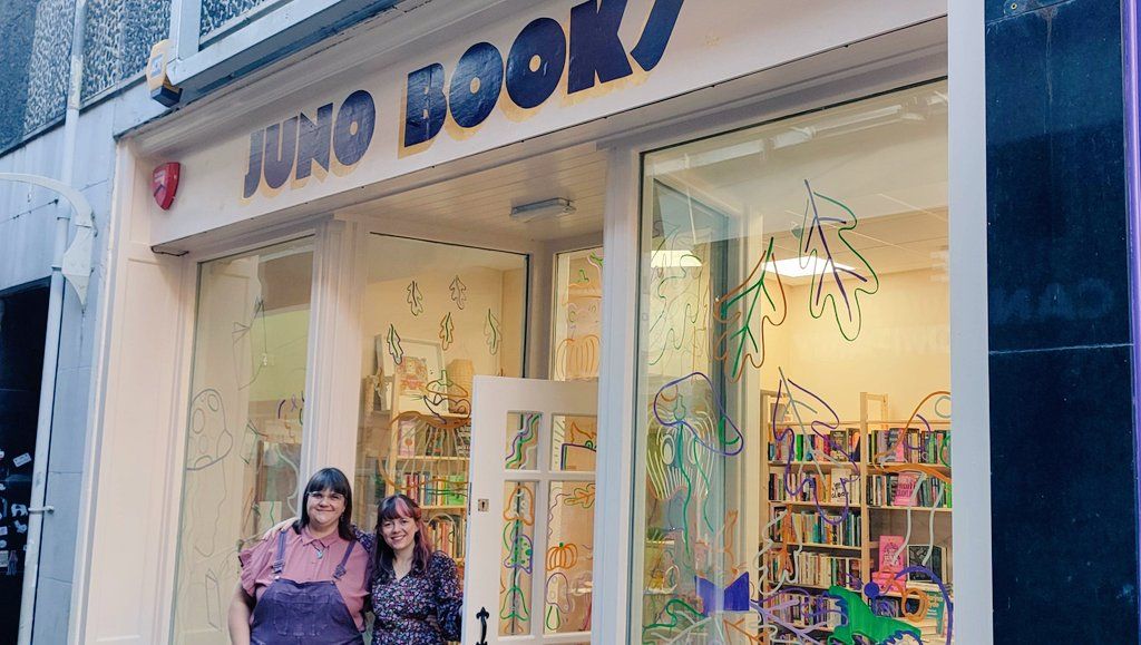 Exterior of Juno Books with two women stood outside