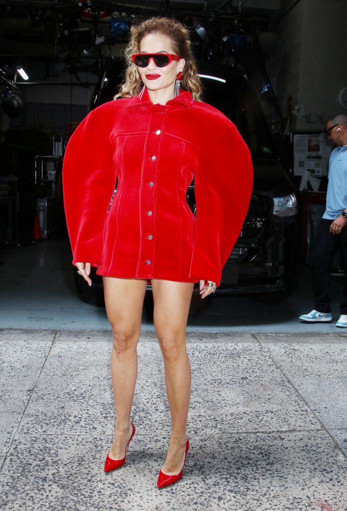 Rita Ora is seen arriving at the 'Live with Kelly and Mark' Show in a red mini dress