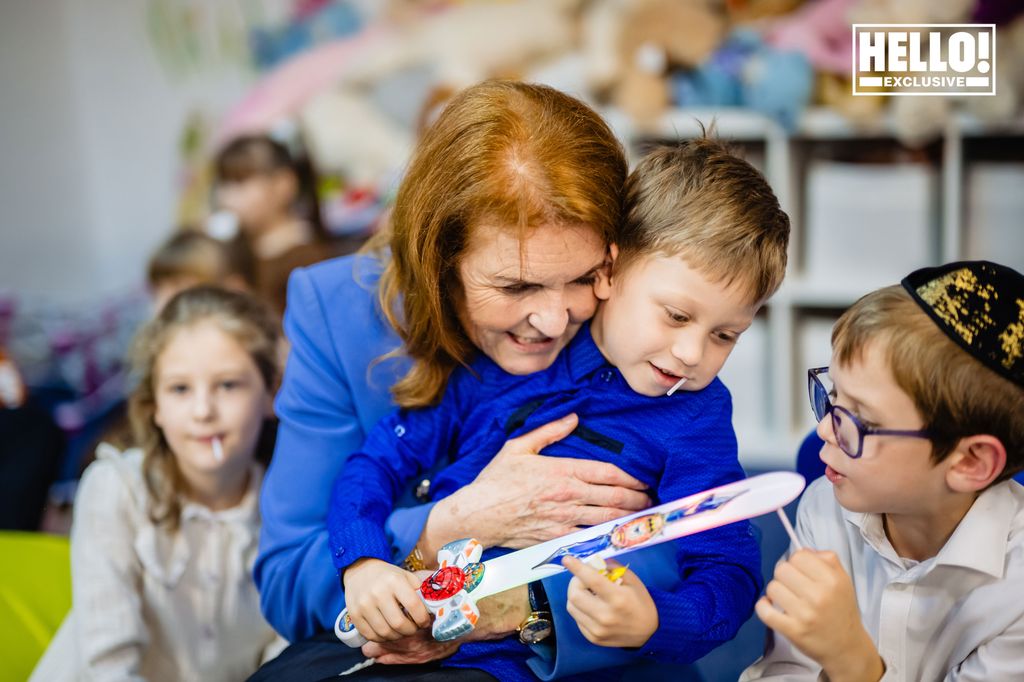 Sarah, Duchess of York pictured hugging a little boy at Tikva children's home in Bucharest 