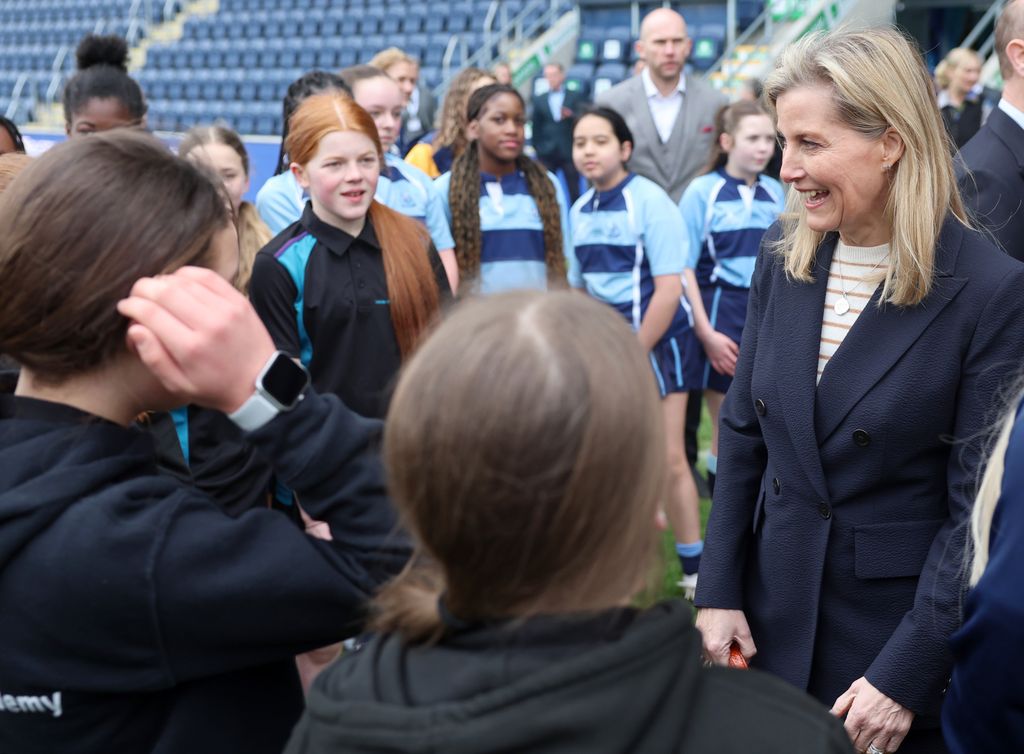 Sophie speaking to young rugby players 