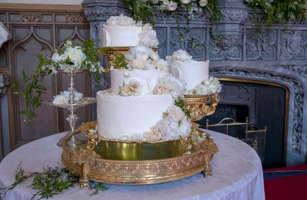 white wedding cake on gold stand