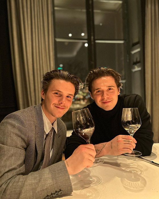 Brooklyn Beckham and brother Cruz enjoying a glass of red wine in Paris