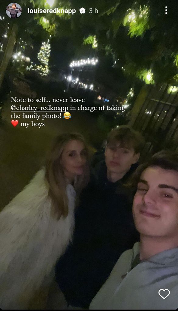 mother taking selfie with two sons 