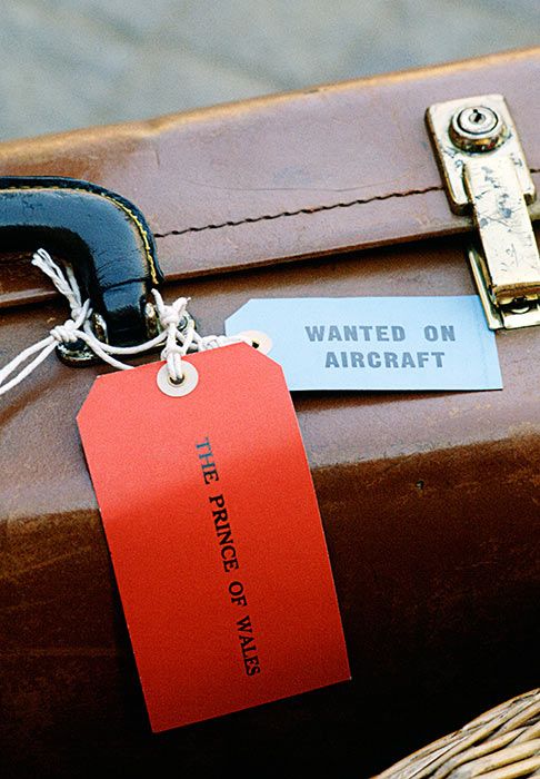 brown leather suitcase with prince charles name on a red tag