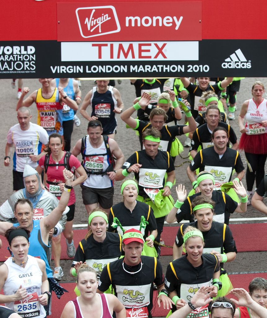 Princess Beatrice crosses the finish line at the London Marathon with her team mates