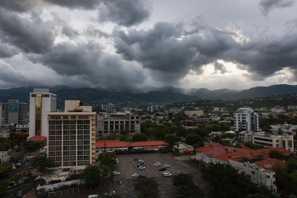 An aerial shot of the city of Kingston with dark clouds