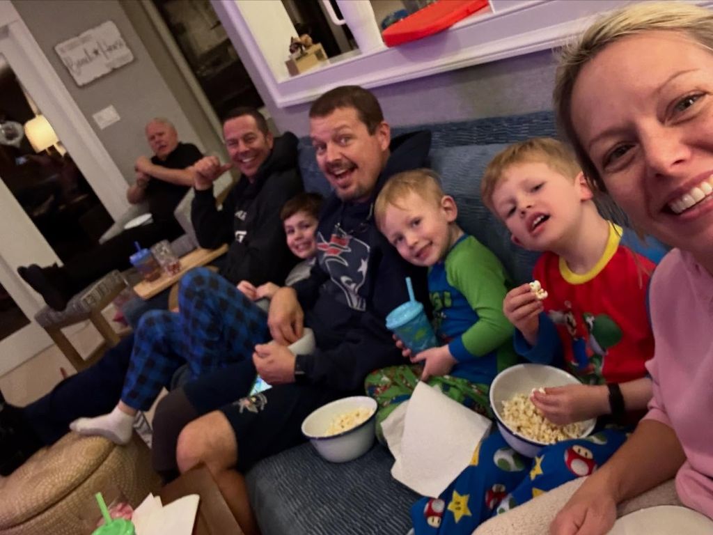 dylan dreyer on a couch with her kids and brothers