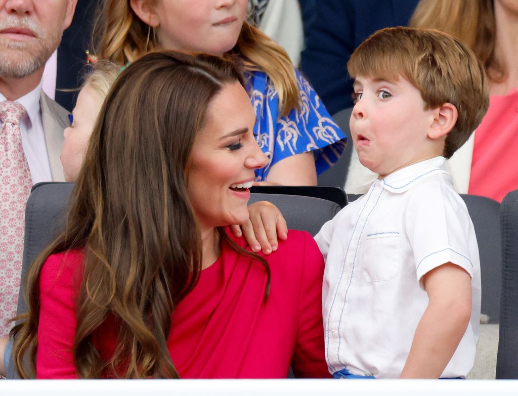 Kate laughing at Louis pulling funny face