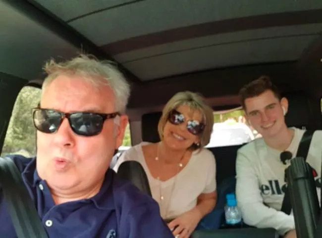 Eamonn Holmes and Ruth Langsford inside a car with their son Jack