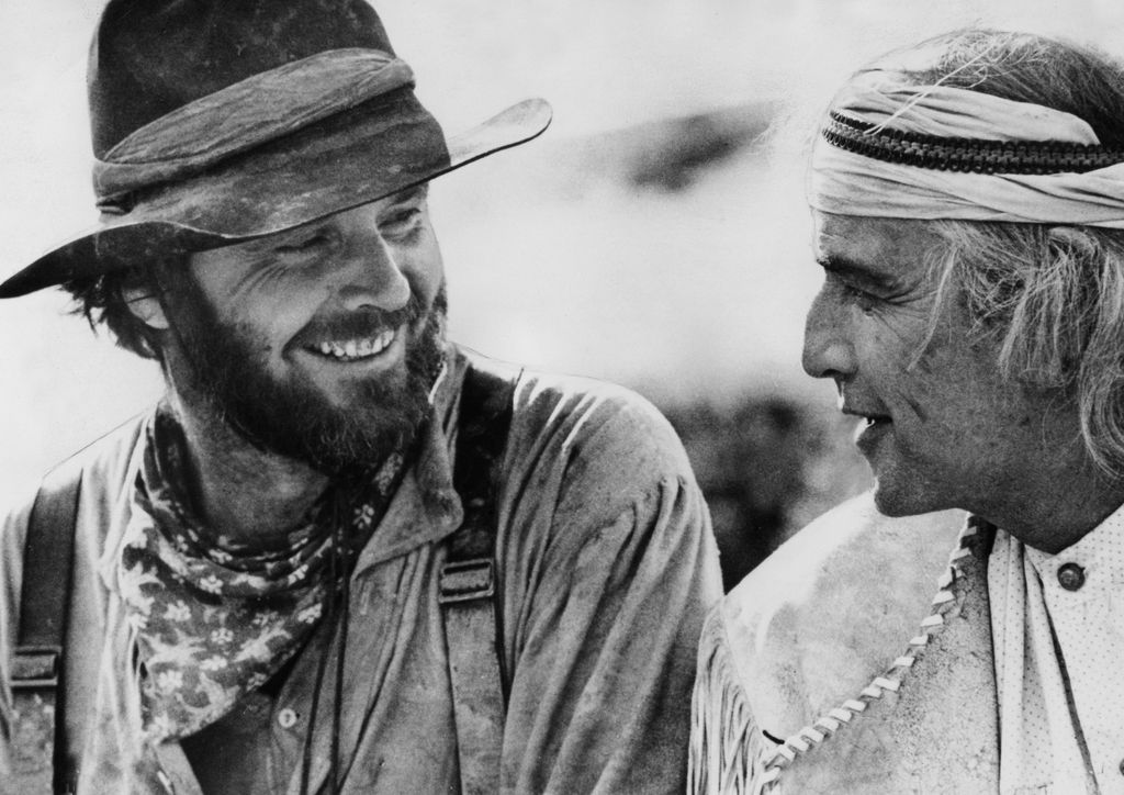 Black and white image showing Jack Nicholson and Marlon Brando on set of the film, The Missouri Breaks 