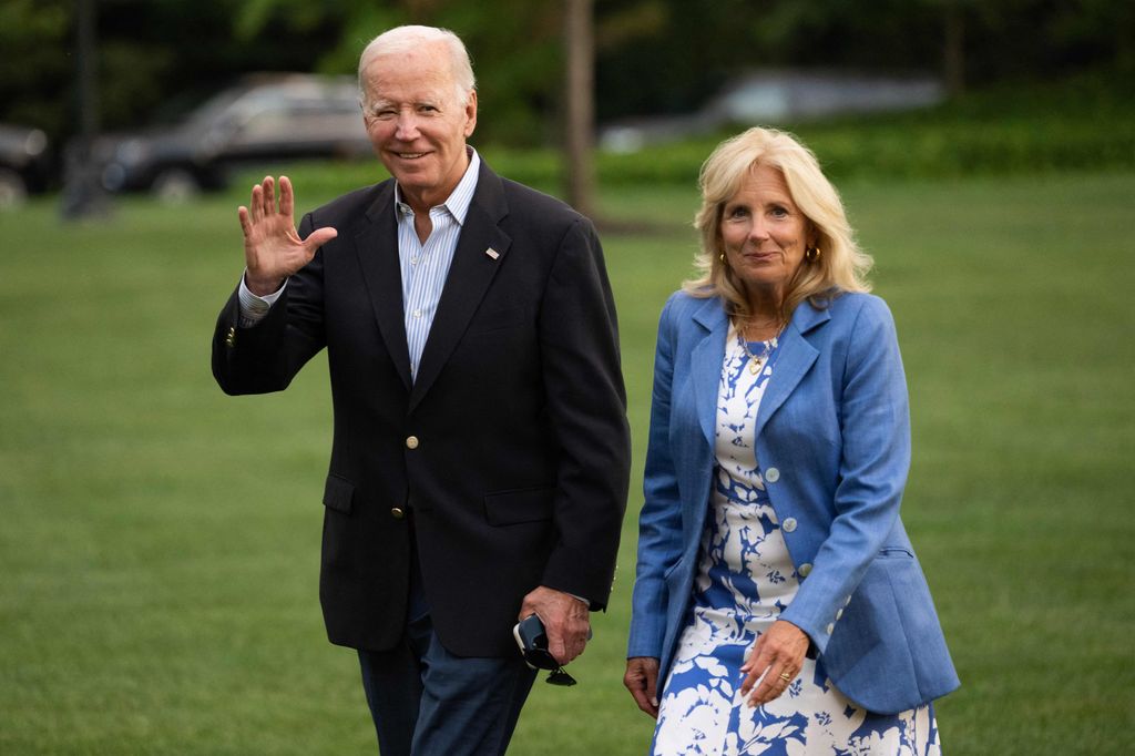 US President Joe Biden and First Lady Jill Biden walk to the White House upon arrival on the South Lawn in Washington, DC, August 26, 2023, 