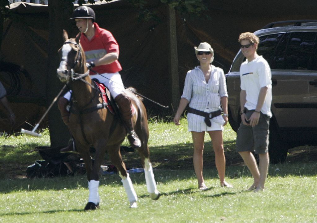 Prince William rides as he is watched by brother Prince Harry and cousin Zara Phillips at Tidworth Polo Club