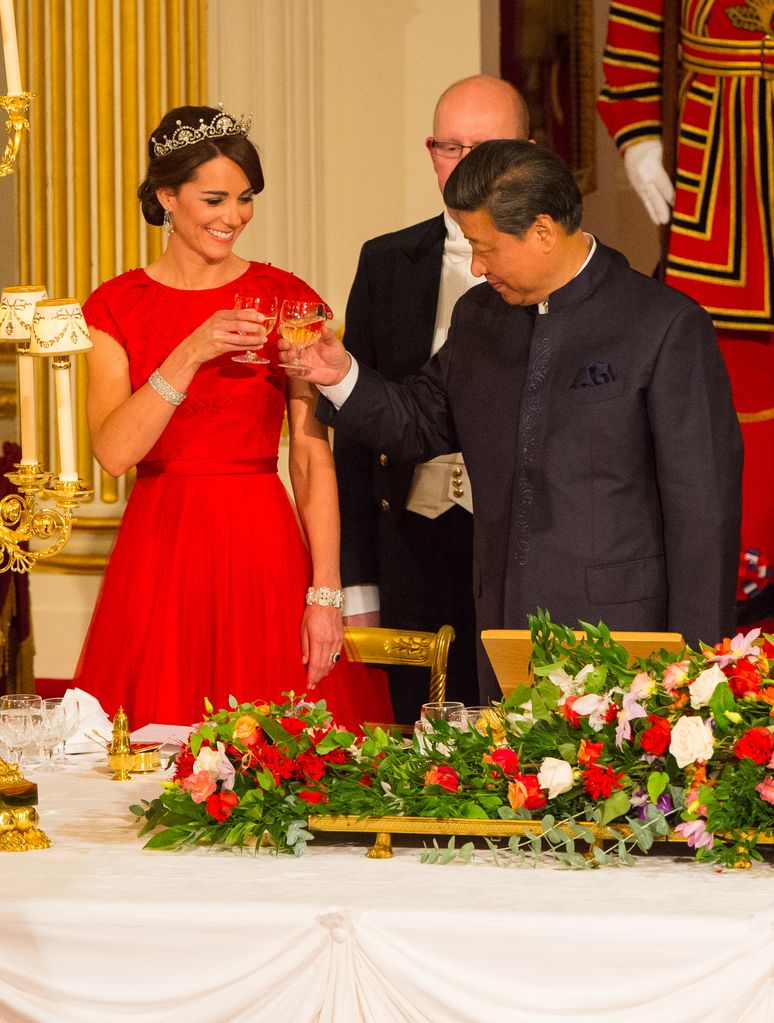 Kate Middleton in a red gown and Lotus Flower tiara