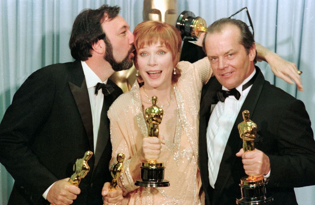 Los Angeles: Academy Award winners Jack Nicholson (R-Best Supporting Actor for Terms of Endearment), Shirley Maclaine (C-Best Actress for Terms of Endearment) and James Brooks (L-Best Picture, Best Director and Best Writing for Terms of Endearment) greet the press holding their Oscars and extremely happy.
