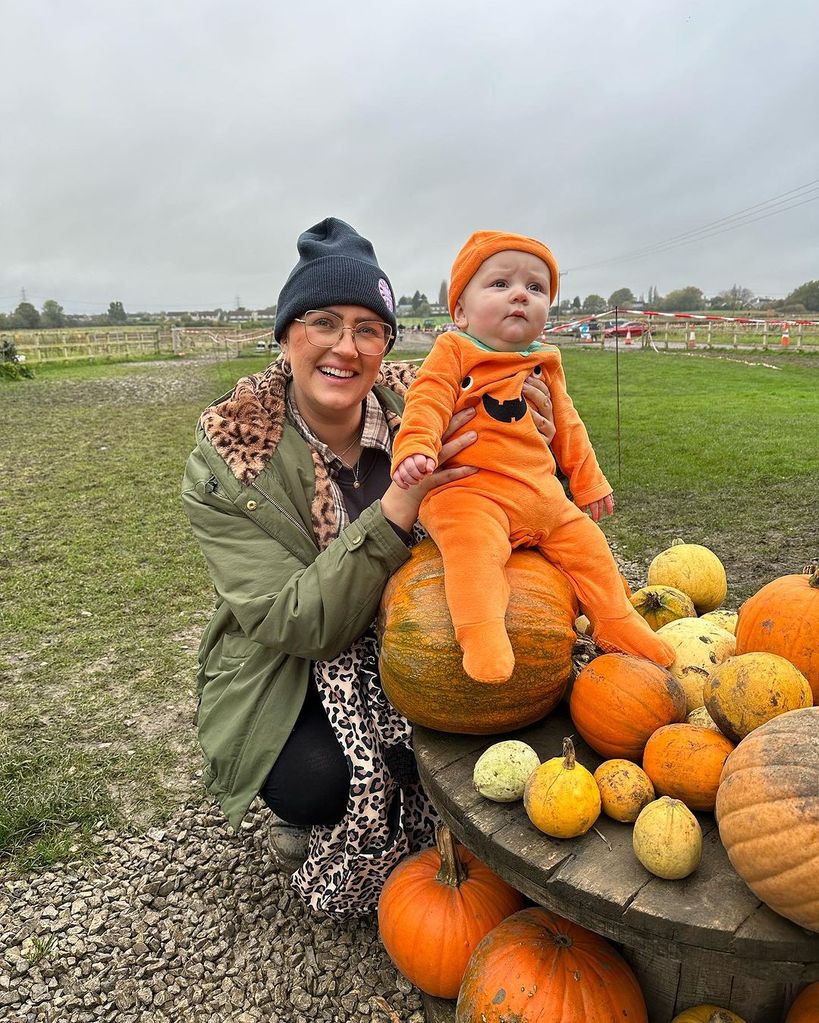 Ellie Warner with Ezra in pumpkin outfit 