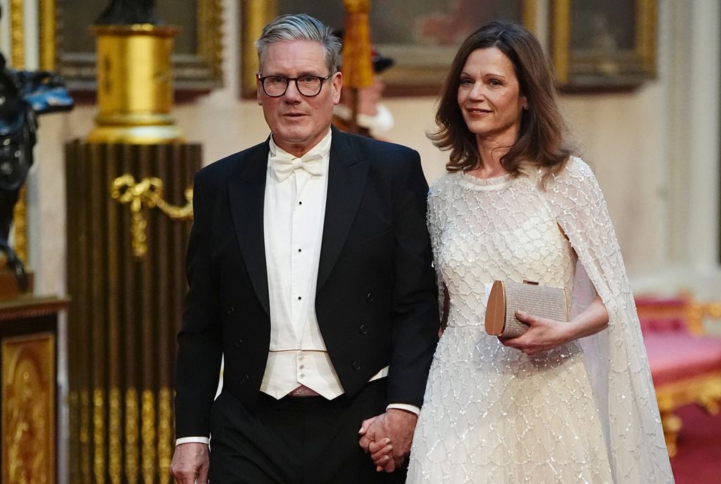 Keir Starmer with his wife Victoria make their way along the East Gallery to attend a State Banquet at Buckingham Palace in London on June 25, 2024