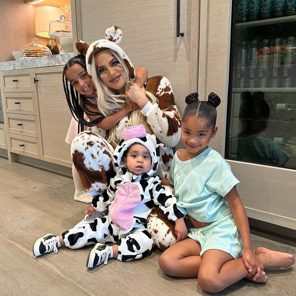 Khloe in cow outfit with true, tatum & dream
