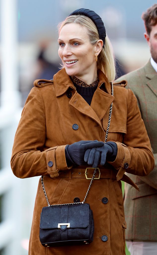 zara tindall wearing a brown suede coat 