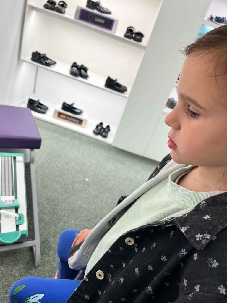 Child trying on shoes