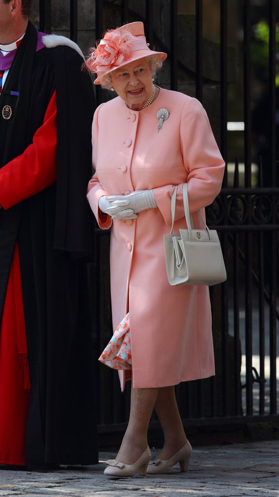 Queen Elizabeth II looked pretty in pink at Zara and Mike Tindall's royal wedding