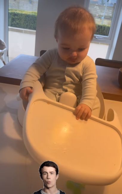 A baby boy with a ruined highchair