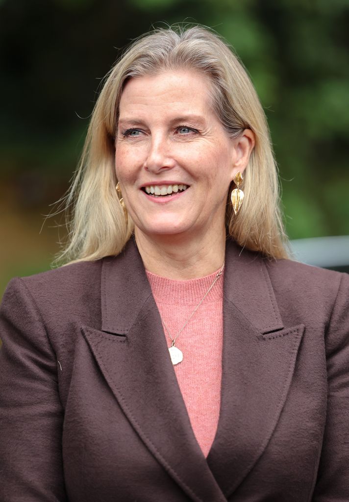 Sophie, Duchess Of Edinburgh smiling in brown blazer