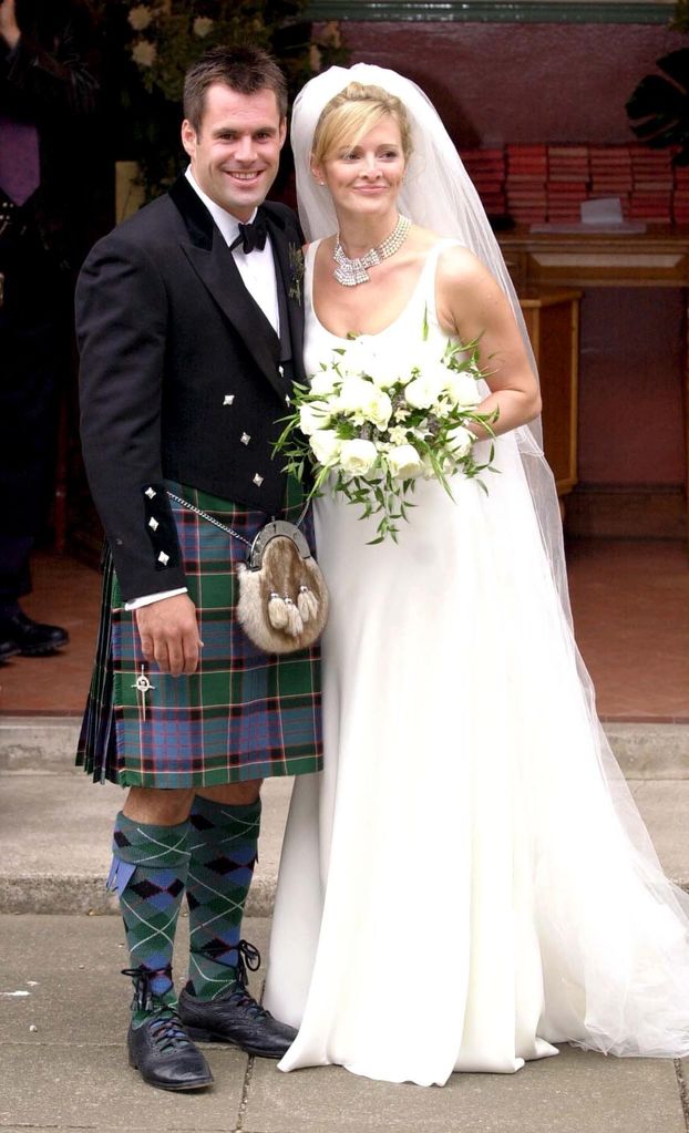 Gabby and Kenny Logan posing for photos on their wedding day