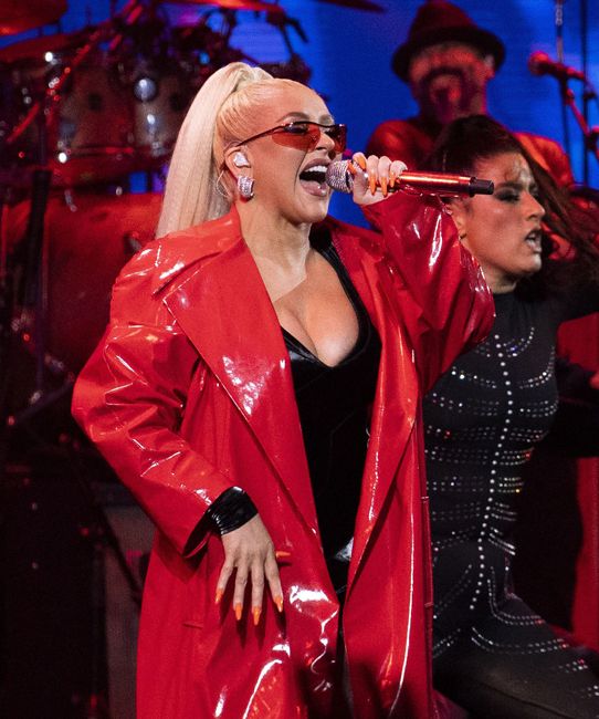 christina aguilera wearing red leather trench to perform at Vina del Mar International Song Festival