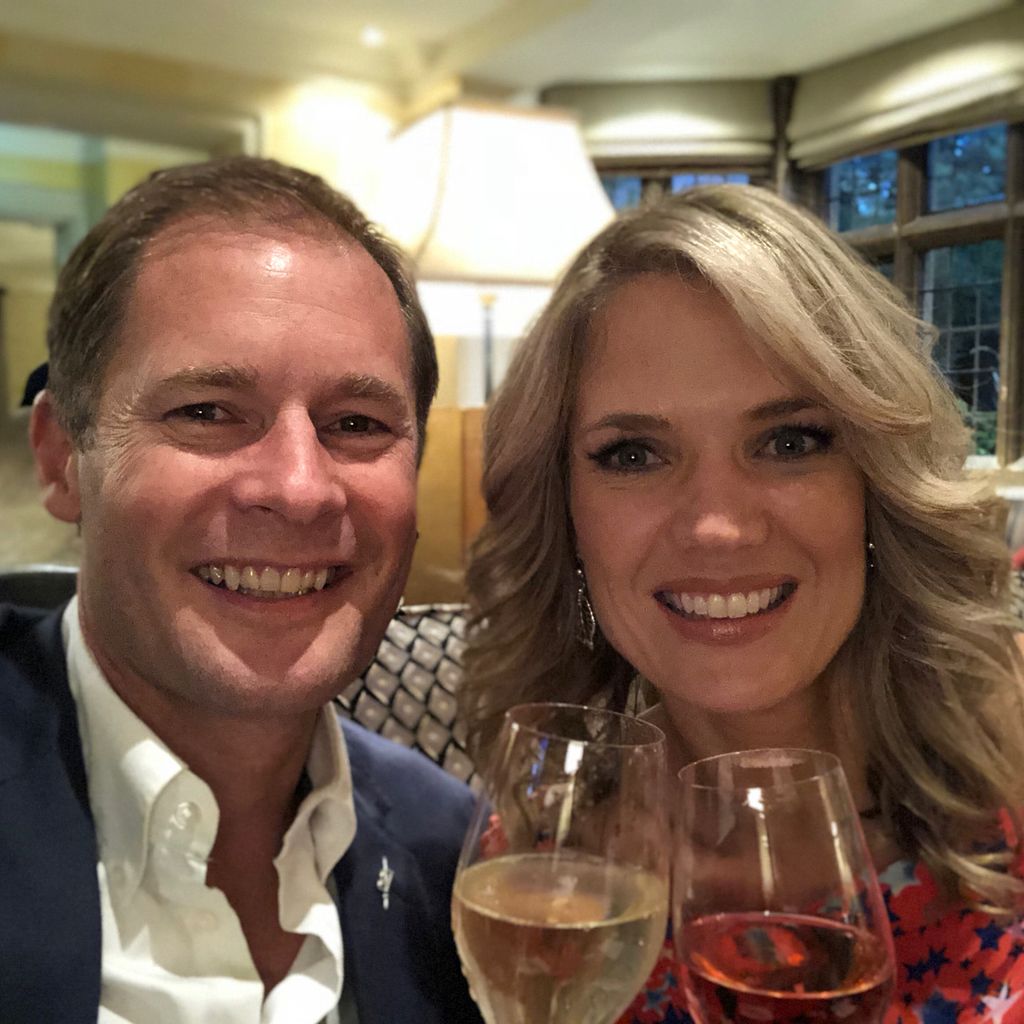 Charlotte Hawkins and her husband Mark raising a glass on their tenth wedding anniversary in 2018
