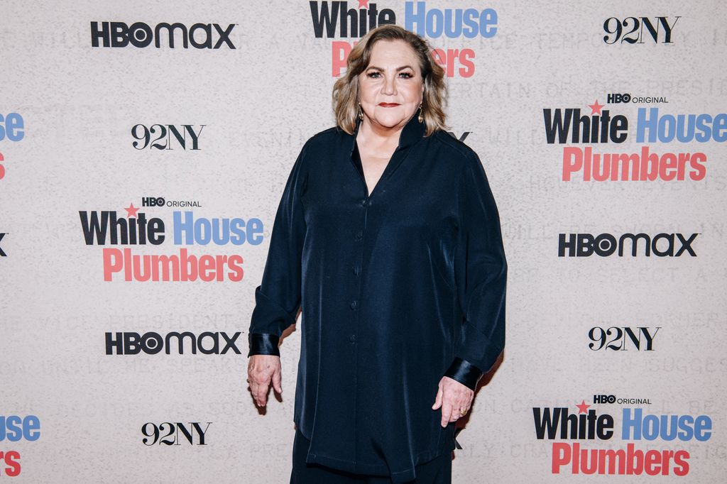 Kathleen Turner in a navy dress in 2023