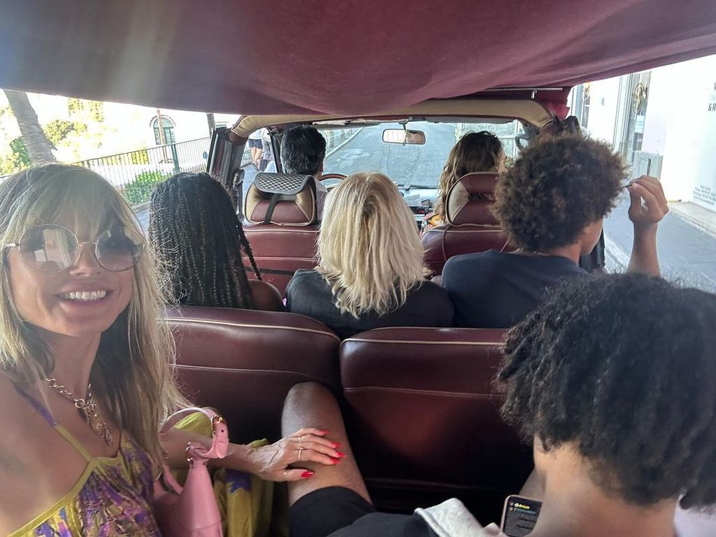 Heidi Klum in car in Italy with kids