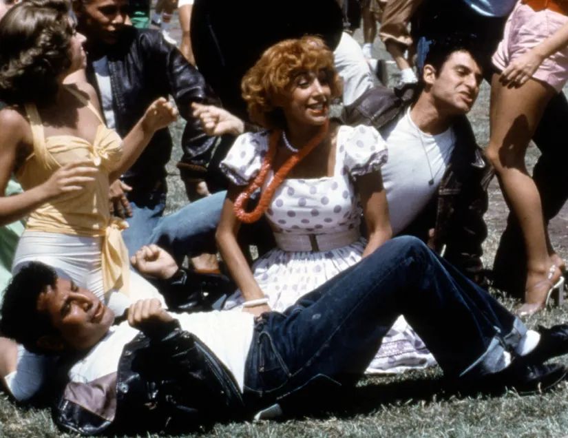 frenchie in a polka dotted dress in grease