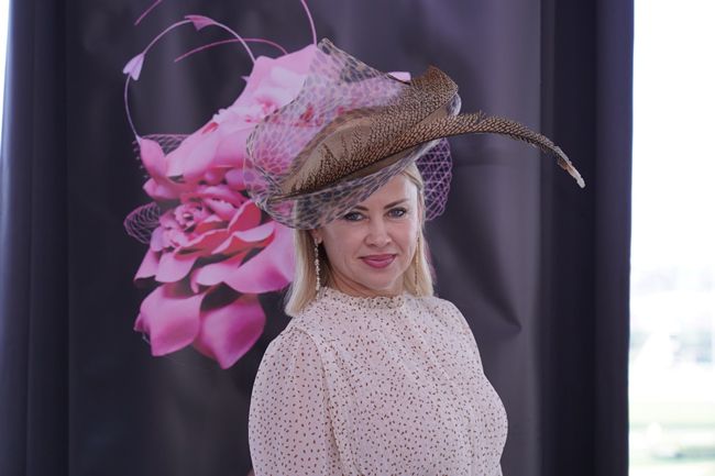 model in pink dress and hat