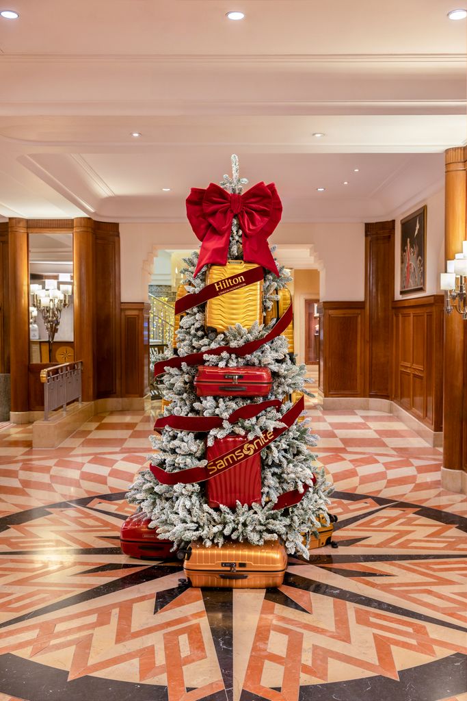 christmas tree decorated with suitcases 